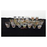 Twenty-eight German shot glasses and one pocket
