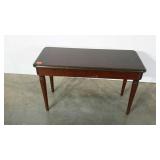 Piano bench with music storage.