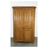 Maple corner cabinet. Upper doors are bi-fold.