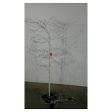 White artificial tree with lights. Great for lots
