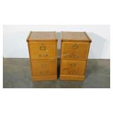 Two oak finished file cabinets, two drawers each.