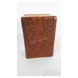 Wooden box with carved floral design and