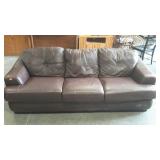 Three cushion, leather-like sofa. Heavy and we