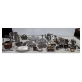 Large metalware group, includes teapot, platters,
