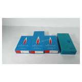 Four boxes of hallmark candles, includes three