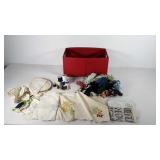 Storage bin of yarn, spools of thread, needles,