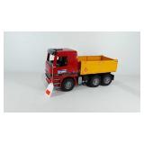 Bruder toy poly dump truck, 16" × 6.5" × 8.5"