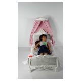 American Girl doll with bed