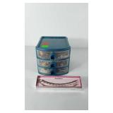 Rubbermaid organizer full of jewelry and box of