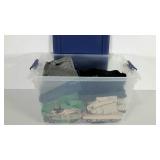 Plastic tote full of clothing, women