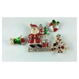 Four Christmas theme brooches