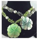 Two multi beaded floral carved stone pendant