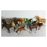 Group of Breyer horses, one is missing ears and