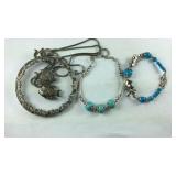 Faux turquoise bracelets and a fish filigree