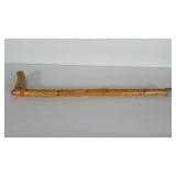 Wooden walking stick with wildlife details etched