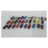 31 toy cars. Most are Hot Wheels brand.