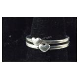 Two Silver Tone Bands With Tiny Hearts With An