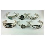 Six silvertone bracelets