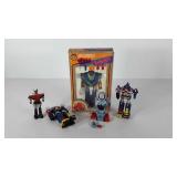 Toys, several transformer type and a tin