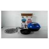 Portable charcoal grill with box, appears to be
