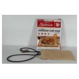 Heated outdoor car mat in box. Condition as