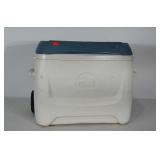 Igloo cooler with extendable handle and wheels.
