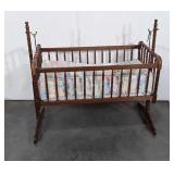 Maple Jenny Lind cradle with bedding, brass