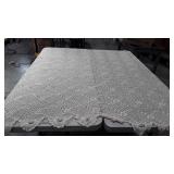 Twin sized lace coverlet.  Needs spot cleaned and