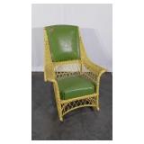Painted wicker rocker, vinyl seat and back,  wear