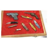 Display with advertising pocket knives and toys