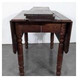 Early oak double drop leaf table,  with three