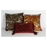 3 throw pillows. One is missing a few sequence.