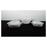 Three corningware dishes with lids, includes blue