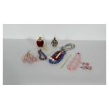 2 perfume bottles and beaded costume jewelry.