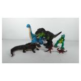 Toys, dinosaurs and alligator with babies