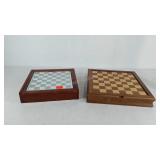 Two chess boards, one glass pieces with mirrored