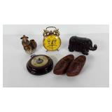 Alarm clock,  mud man figure, wooden shoes,