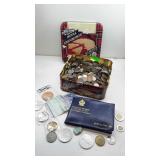 Shortbread tin filled with foreign currency and