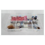 Storage organizer, full of spools of thread,