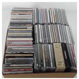 Box of CDs, includes Billie Eilish, John Fogerty,