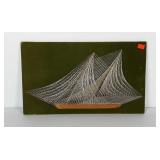 Sailboat string art on board wrapped un green