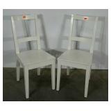 Two white Ikea chairs (Bertil).