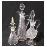 Three glass cruets, 6"-9"