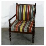 Padded accent chair, perhaps for an enclosed