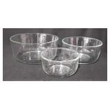 Three glass Pyrex bowls