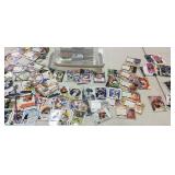 Plastic tub of football sport cards and a few