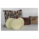 Group of throw pillows. Coverings on most need