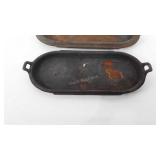 Two cast iron griddle pans, 19" and 22", one has