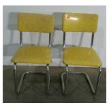 Two vinyl, stainless steel dining chairs, damage