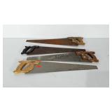4 handsaws in varying conditions.  All are